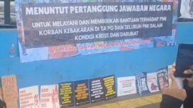 Spanduk tuntutan aksi Internastional Migrant Alliance dan KSPSI MJH