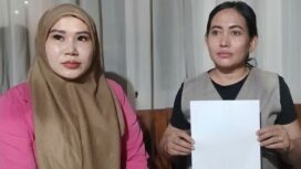 Tukinah menunjukkan surat Laporan Polisi terkait Penipuan dan Penggelapan oleh terlapor Muhamad Sinin